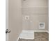 Functional laundry room equipped with washer/dryer hookups and shelving for convenient organization at 20378 Hudson Bay Ln, Westfield, IN 46074