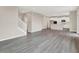 Open-concept living area featuring stylish staircase and views of the kitchen at 20378 Hudson Bay Ln, Westfield, IN 46074