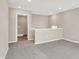 Open loft area featuring neutral paint, plush carpet, and natural light, leading to the laundry room at 20378 Hudson Bay Ln, Westfield, IN 46074