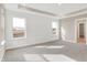 Bright main bedroom featuring three large windows, neutral walls, and plush carpet at 20378 Hudson Bay Ln, Westfield, IN 46074