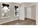 Office space with wood-look floors, neutral paint and large windows providing natural light at 20378 Hudson Bay Ln, Westfield, IN 46074