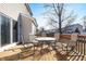 Backyard deck, with a glass-topped table and seating, offers space for outdoor enjoyment at 719 Trent Dr, Greenwood, IN 46143