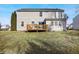 Exterior back view showing deck, siding and backyard lawn at 719 Trent Dr, Greenwood, IN 46143