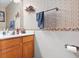 Charming half bath with decorative wallpaper, wood vanity, and ample counter space at 719 Trent Dr, Greenwood, IN 46143