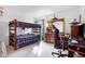 Bedroom features a bunk bed, dresser, and a gaming chair with desk for entertainment at 719 Trent Dr, Greenwood, IN 46143