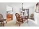 Formal dining room with decorative light fixture adjacent to the eat-in kitchen at 719 Trent Dr, Greenwood, IN 46143