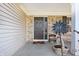 Inviting covered front porch and entry with brick accents and beautiful decor at 719 Trent Dr, Greenwood, IN 46143