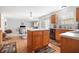 Open-concept kitchen featuring wood cabinets, a kitchen island and stainless steel dishwasher at 719 Trent Dr, Greenwood, IN 46143