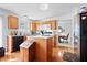 Traditional kitchen features wood cabinets, an island, and stainless steel appliances at 719 Trent Dr, Greenwood, IN 46143