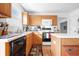 Charming kitchen with wood cabinets, modern appliances, and lots of natural light at 719 Trent Dr, Greenwood, IN 46143