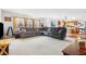 Open-concept living room featuring an expansive sectional sofa and large sunny windows at 719 Trent Dr, Greenwood, IN 46143