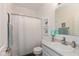 Traditional well lit bathroom with vanity, framed mirror and tub shower at 8118 Ambrosia Ln, Pendleton, IN 46064