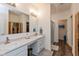 Well lit bathroom with double sink, vanity, walk in shower, and attached sauna at 8118 Ambrosia Ln, Pendleton, IN 46064