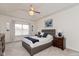 Bright bedroom features vaulted ceiling, neutral decor, ceiling fan, and soft carpet at 8118 Ambrosia Ln, Pendleton, IN 46064