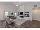 Bright living room with tall ceilings, fireplace, and large windows that let in ample natural light at 8118 Ambrosia Ln, Pendleton, IN 46064