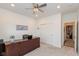 Bright office features neutral decor, ceiling fan, soft carpet, and ample space at 8118 Ambrosia Ln, Pendleton, IN 46064