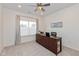 Bright office features neutral decor, ceiling fan, soft carpet, and a window at 8118 Ambrosia Ln, Pendleton, IN 46064