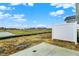 Backyard view, looking to the pond and other residences, from the grey patio area at 413 Onset Way, Westfield, IN 46074