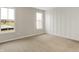 Bright bedroom with carpet floors, vertical trim accent wall, and natural light from windows at 413 Onset Way, Westfield, IN 46074