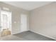 Clean bedroom with gray carpet, white doors, and easy access to ensuite bathroom at 413 Onset Way, Westfield, IN 46074
