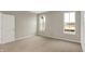 Bright bedroom featuring neutral walls, plush carpeting and abundant natural light from two large windows at 413 Onset Way, Westfield, IN 46074