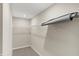 A carpeted walk-in closet with light-grey walls and a high wire storage shelf at 413 Onset Way, Westfield, IN 46074