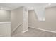 Well-lit hallway with neutral walls and carpeted flooring at 413 Onset Way, Westfield, IN 46074