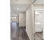 Spacious hallway with wood floors leading to various rooms including a half bathroom at 413 Onset Way, Westfield, IN 46074
