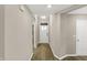 Bright entryway featuring wood floors, neutral walls, and a view of the front door at 413 Onset Way, Westfield, IN 46074