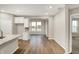 Bright open kitchen showcasing an island and nearby dining area with plenty of natural light at 413 Onset Way, Westfield, IN 46074