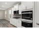 Close-up of the kitchen showcasing stainless steel appliances, a gas stovetop, and stylish backsplash at 413 Onset Way, Westfield, IN 46074