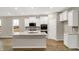 Spacious kitchen featuring an island with sink, stainless steel appliances, and ample white cabinetry at 413 Onset Way, Westfield, IN 46074