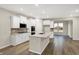 Wide view of the kitchen, featuring a large island, stainless appliances, and white cabinetry at 413 Onset Way, Westfield, IN 46074