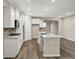 Spacious kitchen featuring an island, stainless steel appliances, and ample counter space with white cabinetry at 413 Onset Way, Westfield, IN 46074