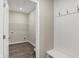 Practical laundry room with wire shelving, a bench, and coat hooks for convenience at 413 Onset Way, Westfield, IN 46074