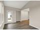 Open-concept living area with hardwood floors and abundant natural light through glass door at 413 Onset Way, Westfield, IN 46074