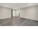 Spacious living room featuring modern gray hardwood floors and recessed lighting at 413 Onset Way, Westfield, IN 46074