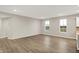 Bright living room with hardwood floors and natural light from the double windows at 413 Onset Way, Westfield, IN 46074