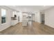 Bright and open living space featuring wood floors, white cabinets, and an island at 413 Onset Way, Westfield, IN 46074
