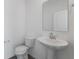Clean bathroom with pedestal sink and updated fixtures at 1116 Bevy Blvd, Danville, IN 46122
