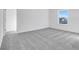 Bright bedroom with grey carpet and door at 1116 Bevy Blvd, Danville, IN 46122