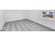 Bright bedroom with grey carpet and large window at 1116 Bevy Blvd, Danville, IN 46122