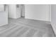 Bright hallway with grey carpet and access to rooms at 1116 Bevy Blvd, Danville, IN 46122