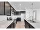 Modern kitchen with dark cabinets and stainless steel appliances at 1116 Bevy Blvd, Danville, IN 46122