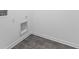 Laundry area with grey tile floor at 1116 Bevy Blvd, Danville, IN 46122