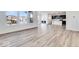 Open concept living room with kitchen view and hardwood floors at 1116 Bevy Blvd, Danville, IN 46122