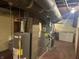 Basement view showing water heater, furnace, and other mechanical equipment at 3305 N Keystone Ave, Indianapolis, IN 46218