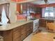 Spacious kitchen with wooden cabinets, functional appliances, and ample counter space at 3305 N Keystone Ave, Indianapolis, IN 46218