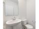 Clean bathroom with pedestal sink and toilet at 5759 Cr W 750 N, McCordsville, IN 46055