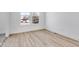 Bright bedroom with hardwood floors and large window at 5759 Cr W 750 N, McCordsville, IN 46055